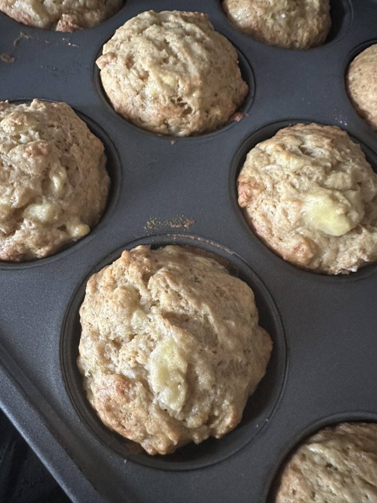 Freshly baked banana muffins in a muffin tin